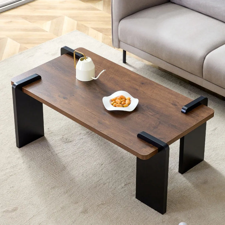 Walnutcolored MDF coffee table suitable for modern minimalist living rooms and leisure areas with product dimensions of 39.323.